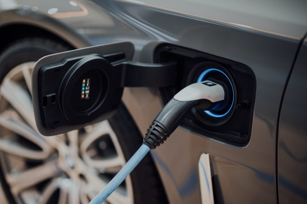 close up of a grey electric vehicle charging