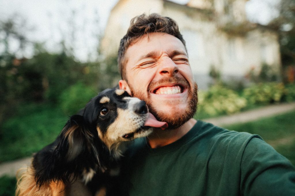 dog licking a man's face