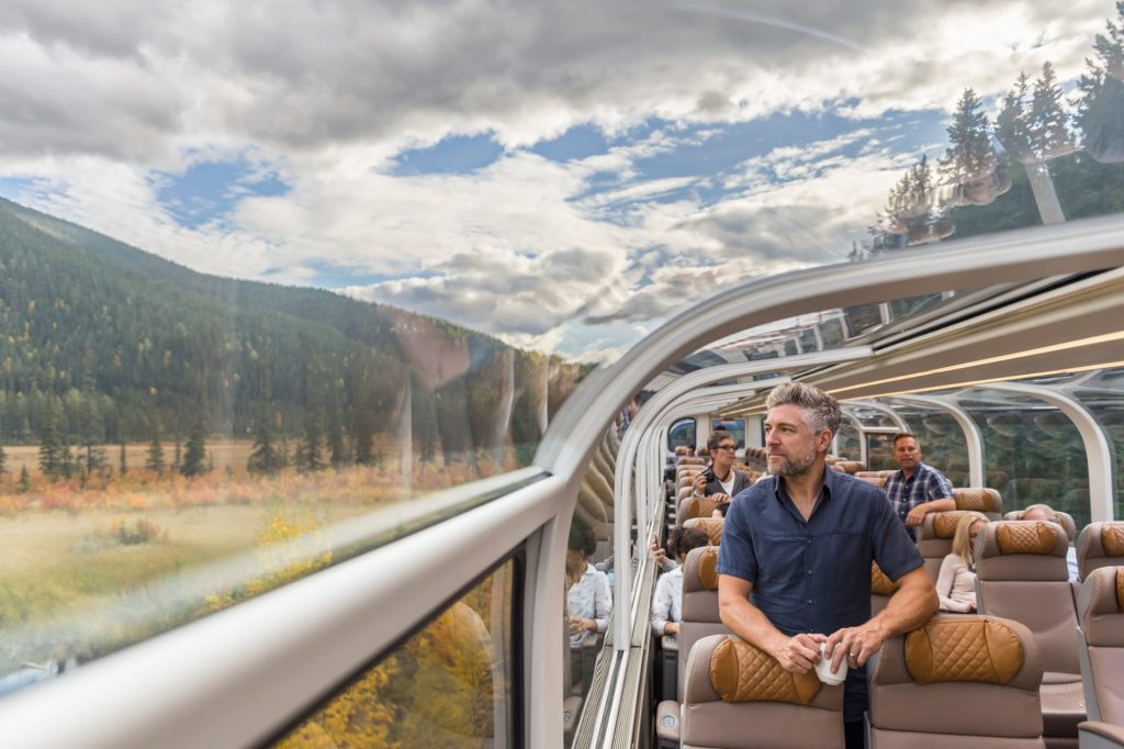 Man looking out window on Rocky Mountaineer