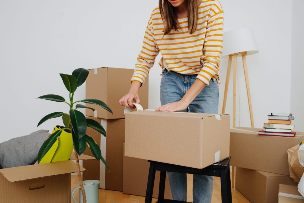 woman packing moving boxes