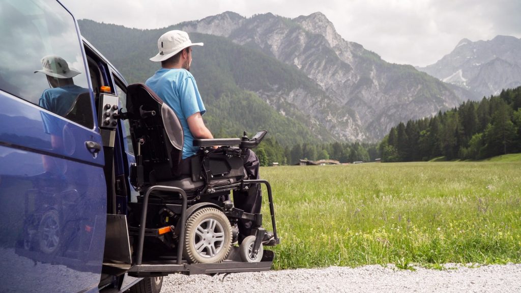 Man with a mobility aid travels to the mountains