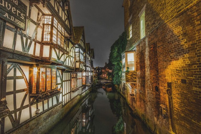 The rivers of Cantebury wind past buildings lit up at night