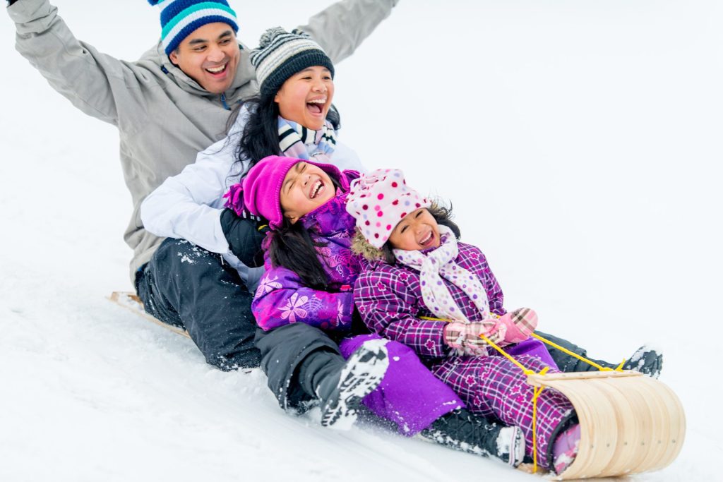 family winter sledding