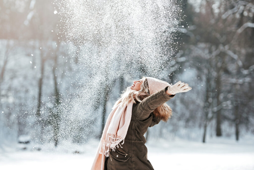 woman enjoying in the snow