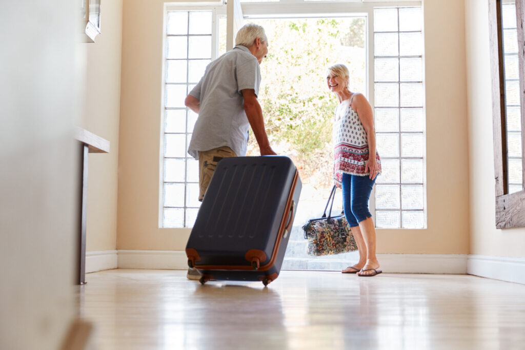 Couple leaving house for a vacation