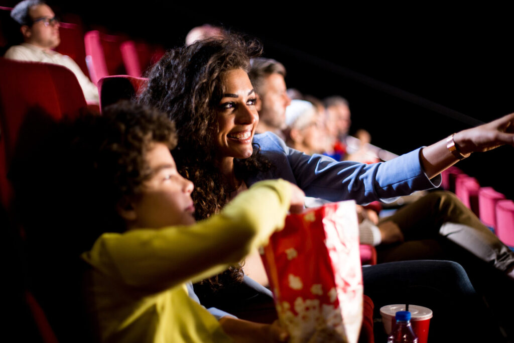 woman watching a movie with her son