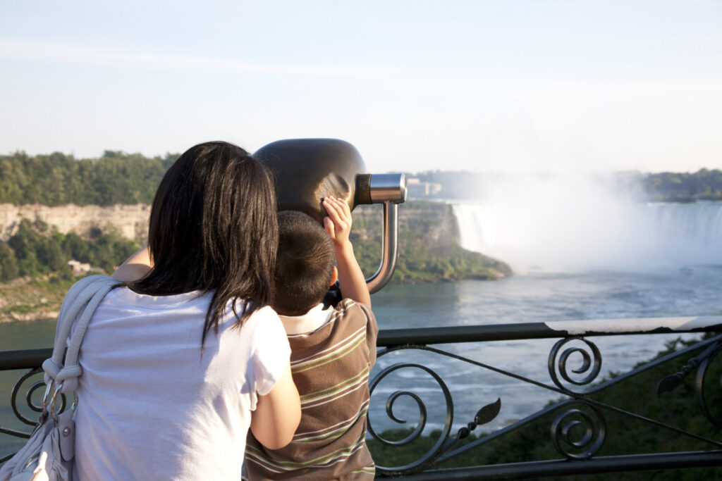 Mother and son looking at Niagara Falls