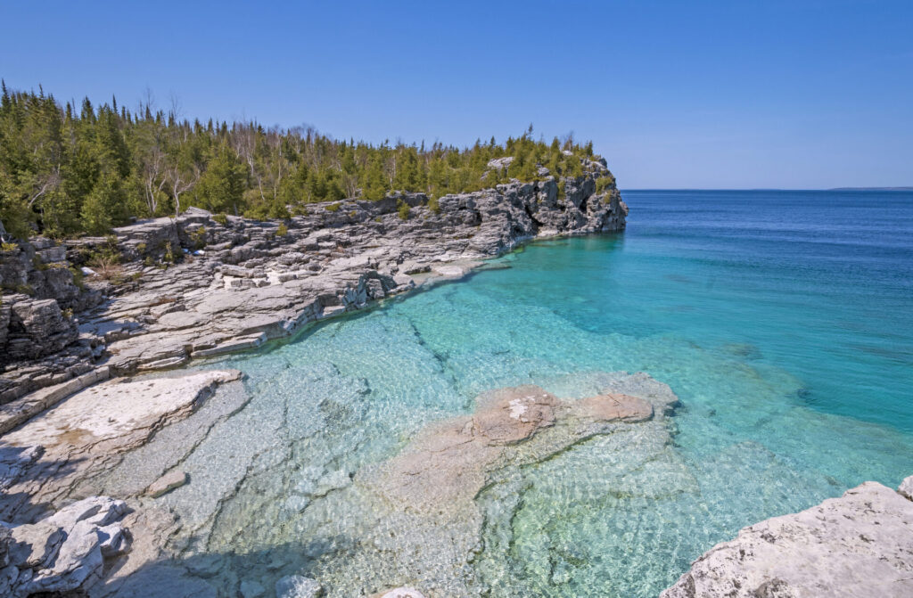 Clear Waters in a Gray Cliffed Cove