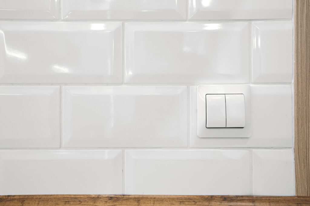 Switch buttons in white kitchen interior