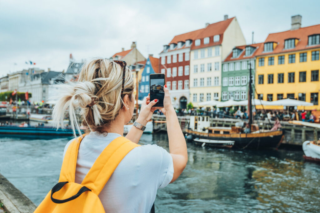 Traveling to Copenhagen - tourist in Nyhavn