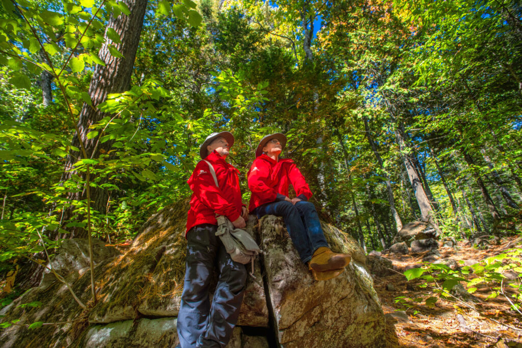 Hikers resting in Estivant Pines Nature Sanctuary in Keweenaw County, Michigan, USA.