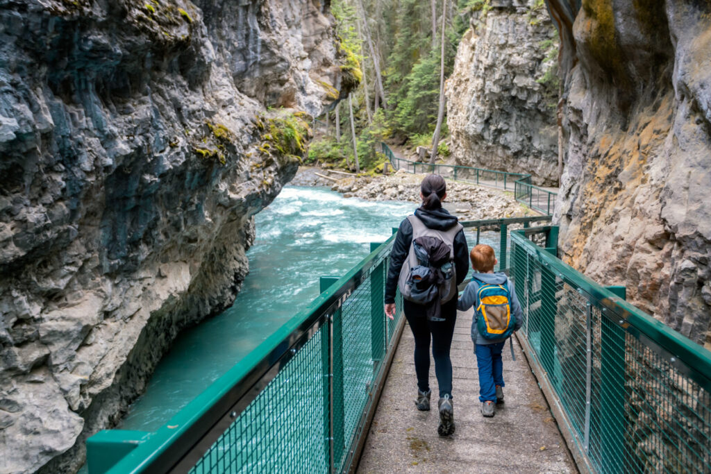 Mother and Son Hiking at Johnson Canyon in Banff National Park, Canada