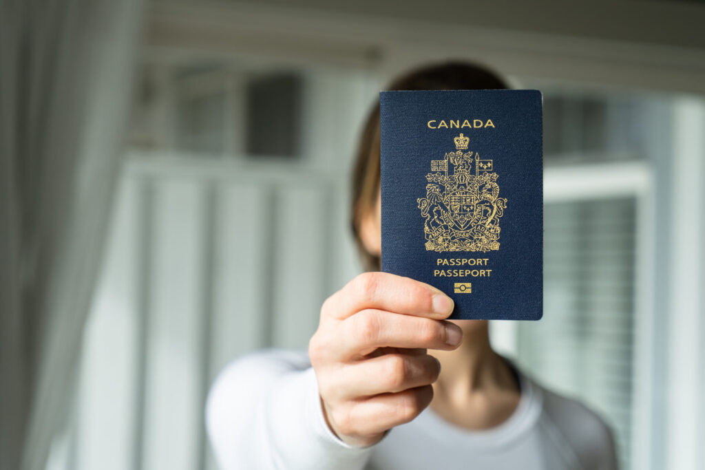 Woman holding Canadian Passport