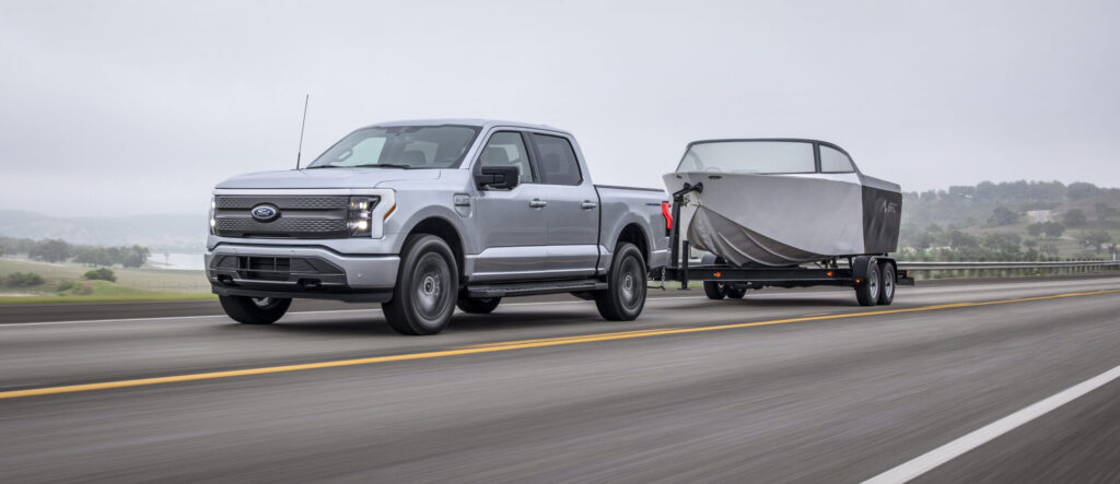 Ford Lightning XLT electric truck towing a boat
