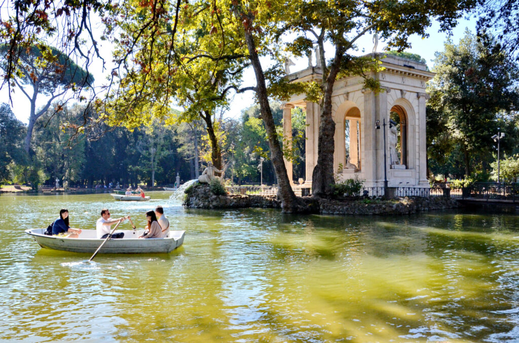 People rowing on the pond in the Villa Borghese Park